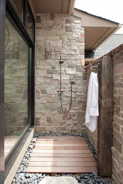 outdoor stone shower Designed by John Kraemer & Sons contractor