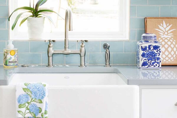 transitional kitchen with blue subway tiles