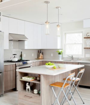 Seminars And Events 6 A modern wood grain style kitchen redesign featuring an island with pull up chairs and plenty of nooks for storage